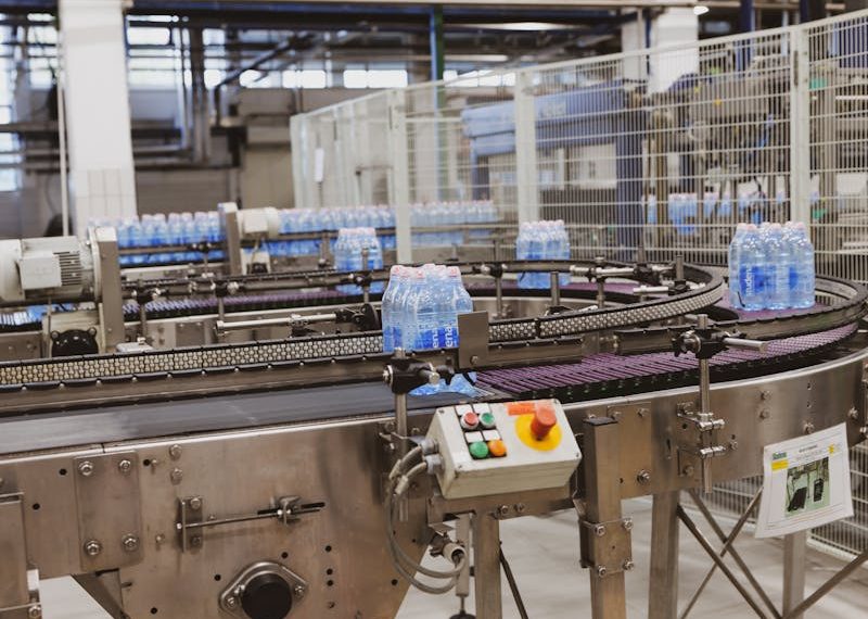 an automated conveyor system for bottled water manufacturing and distribution
